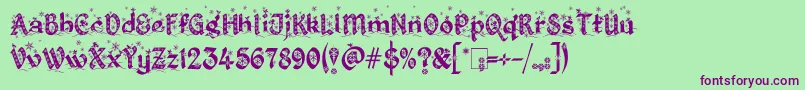 Fonte KingthingsChristmas2.2 – fontes roxas em um fundo verde