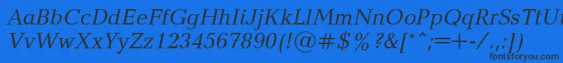 Czcionka UkrainianbalticaItalic – czarne czcionki na niebieskim tle