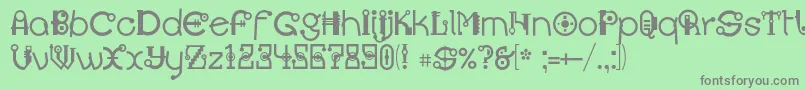 フォントMontesummac – 緑の背景に灰色の文字