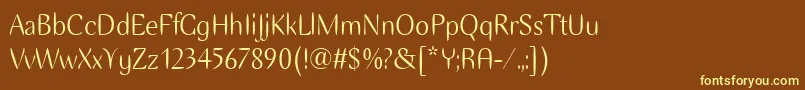 EllipseItcTt-fontti – keltaiset fontit ruskealla taustalla
