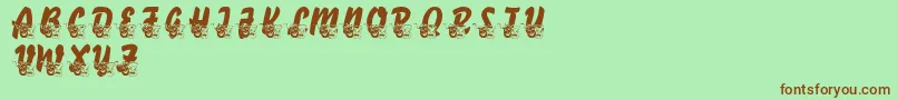フォントLmsComedyOfTragedies – 緑の背景に茶色のフォント
