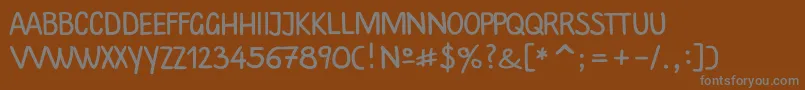 Шрифт Plainscriptc – серые шрифты на коричневом фоне