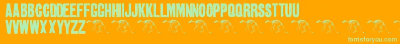 Golden0Pony-Schriftart – Grüne Schriften auf orangefarbenem Hintergrund