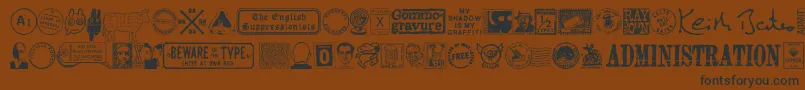 フォントMaGraphics – 黒い文字が茶色の背景にあります