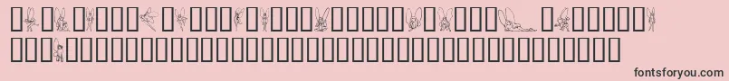 Czcionka SlWoodcutFaeries – czarne czcionki na różowym tle