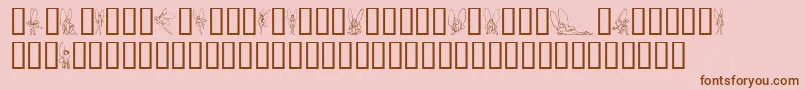 フォントSlWoodcutFaeries – ピンクの背景に茶色のフォント