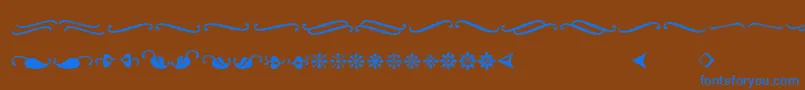 Ornementsadf-Schriftart – Blaue Schriften auf braunem Hintergrund
