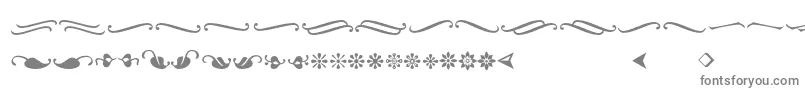Ornementsadf-fontti – harmaat kirjasimet valkoisella taustalla