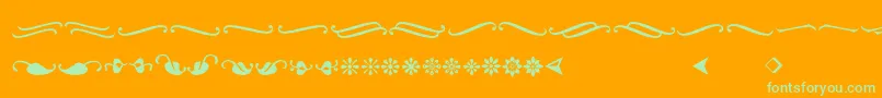 Ornementsadf-Schriftart – Grüne Schriften auf orangefarbenem Hintergrund