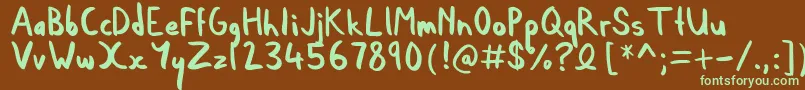 フォントDylan – 緑色の文字が茶色の背景にあります。