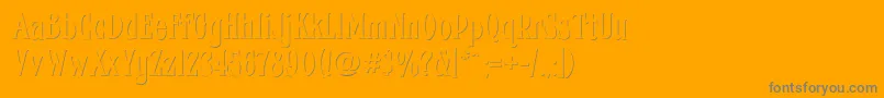 Fhacondfrenchshadenc-Schriftart – Graue Schriften auf orangefarbenem Hintergrund