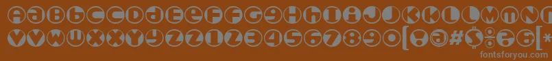 Roundel-fontti – harmaat kirjasimet ruskealla taustalla