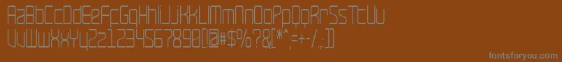 RaveNarrow-fontti – harmaat kirjasimet ruskealla taustalla