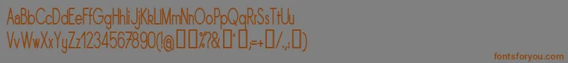 フォントSornrgc – 茶色の文字が灰色の背景にあります。