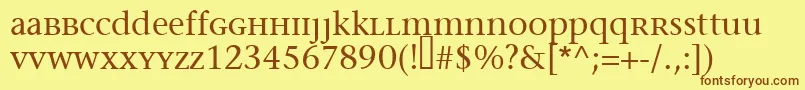 フォントMigraineserif – 茶色の文字が黄色の背景にあります。