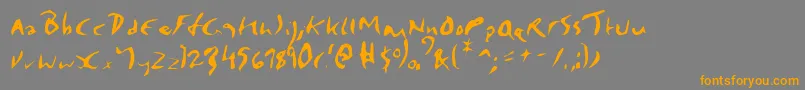 フォントElmore – オレンジの文字は灰色の背景にあります。