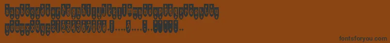 PopuluxeDeemonds-Schriftart – Schwarze Schriften auf braunem Hintergrund