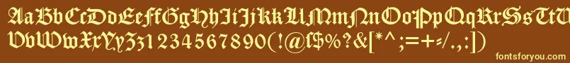 Dscaslongotisch-fontti – keltaiset fontit ruskealla taustalla
