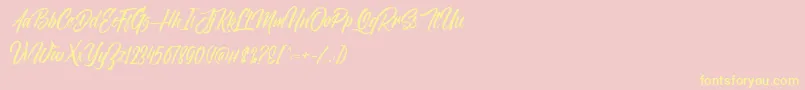 Fonte NovithaScriptDemo – fontes amarelas em um fundo rosa
