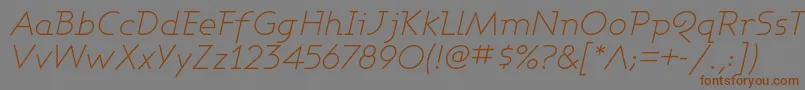 フォントAshbli – 茶色の文字が灰色の背景にあります。