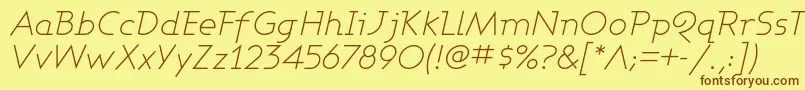 フォントAshbli – 茶色の文字が黄色の背景にあります。