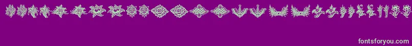 フォントSchlussVignetten – 紫の背景に緑のフォント