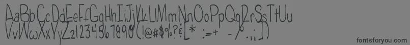 フォントPoisonedapples – 黒い文字の灰色の背景