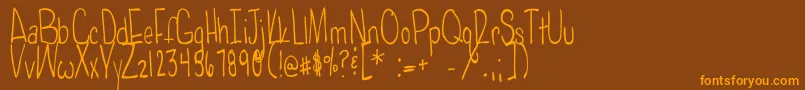 Poisonedapples-fontti – oranssit fontit ruskealla taustalla