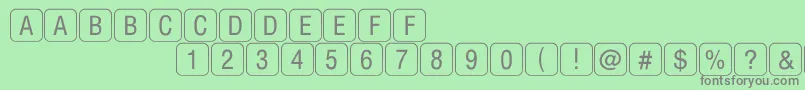 Fonte RrkeyletterslimitedNormal – fontes cinzas em um fundo verde