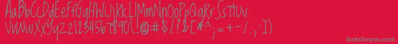 Loved-Schriftart – Graue Schriften auf rotem Hintergrund