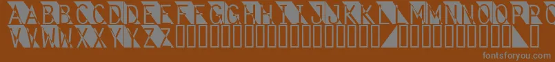 Fantomet-Schriftart – Graue Schriften auf braunem Hintergrund