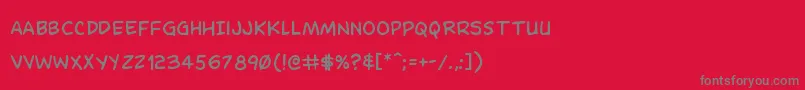 フォントDominomask – 赤い背景に灰色の文字