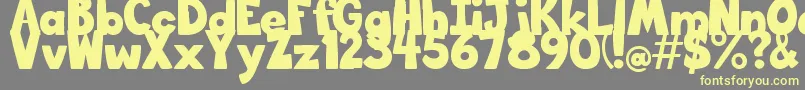 BigBottomTypefaceNormal Font – Yellow Fonts on Gray Background