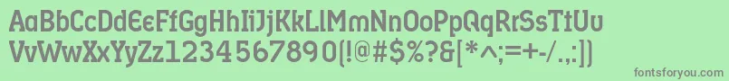 Gvardiamediumc-fontti – harmaat kirjasimet vihreällä taustalla
