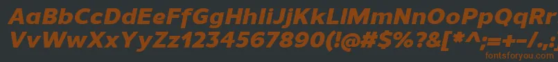 UnimanHeavyitalic-fontti – ruskeat fontit mustalla taustalla