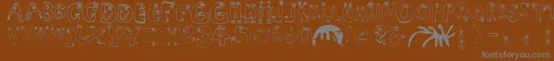 Humanabc Font – Gray Fonts on Brown Background