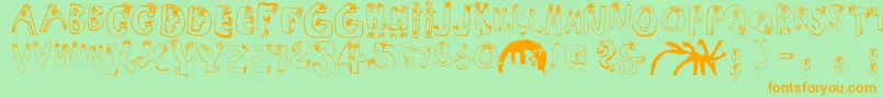 Humanabc-Schriftart – Orangefarbene Schriften auf grünem Hintergrund