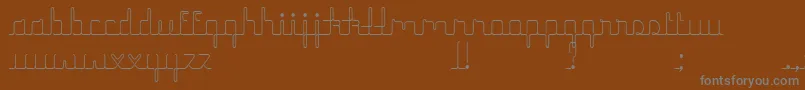 Шрифт HerrlichesScript – серые шрифты на коричневом фоне