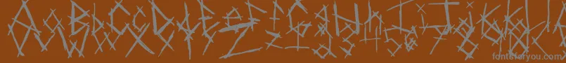 Czcionka ChikenSkratch – szare czcionki na brązowym tle