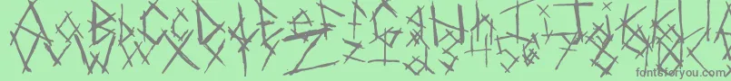 ChikenSkratch-Schriftart – Graue Schriften auf grünem Hintergrund