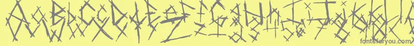 ChikenSkratch-fontti – harmaat kirjasimet keltaisella taustalla