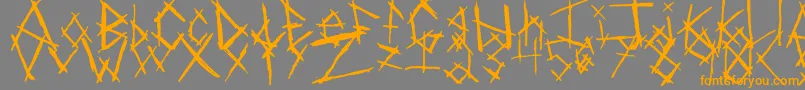 ChikenSkratch-Schriftart – Orangefarbene Schriften auf grauem Hintergrund