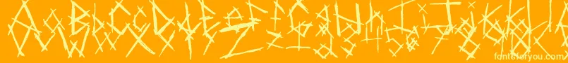 Czcionka ChikenSkratch – żółte czcionki na pomarańczowym tle