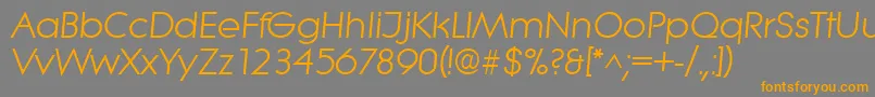 フォントLiteraItalic – オレンジの文字は灰色の背景にあります。