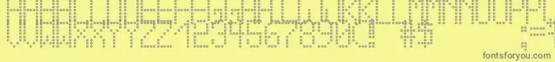 フォントCrossLedTfb – 黄色の背景に灰色の文字