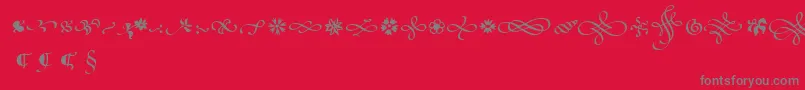 PoeticaSuppOrnaments Font – Gray Fonts on Red Background