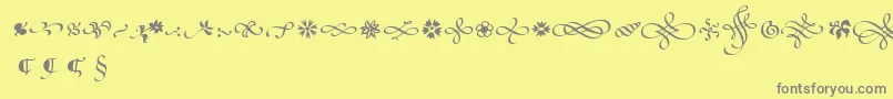 PoeticaSuppOrnaments Font – Gray Fonts on Yellow Background