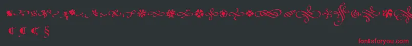 フォントPoeticaSuppOrnaments – 黒い背景に赤い文字
