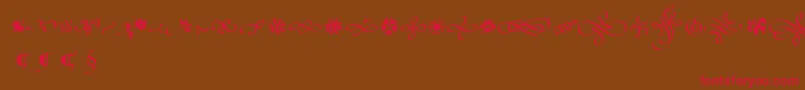 Police PoeticaSuppOrnaments – polices rouges sur fond brun