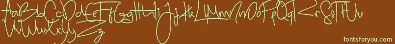 フォントSugar ffy – 緑色の文字が茶色の背景にあります。